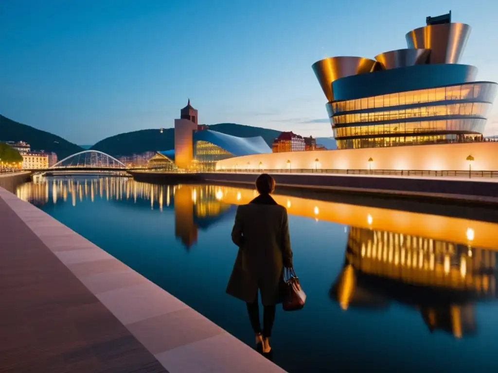 Vista serena del atardecer en el waterfront de Bilbao, con el suave resplandor de las luces de la calle reflejadas en las aguas tranquilas y la silueta del icónico Museo Guggenheim al fondo, evocando tranquilidad y relevancia cultural en el Festival Internacional de Literatura Bil